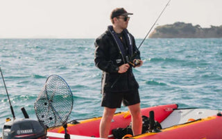 An angler safely fishing with his catamaran inflatable boat