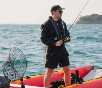 An angler safely fishing with his catamaran inflatable boat