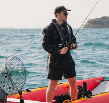 An angler safely fishing with his catamaran inflatable boat