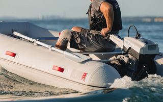 A boater on sail with his Electric Outboard Motor-Powered True Kit Navigator 