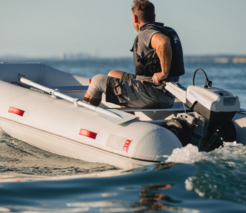 A boater on sail with his Electric Outboard Motor-Powered True Kit Navigator 