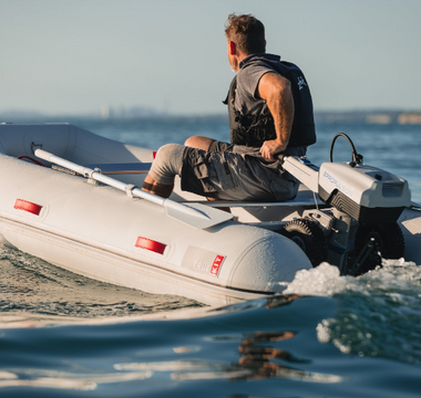 A boater on sail with his Electric Outboard Motor-Powered True Kit Navigator 