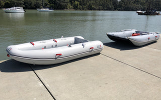 Navigator 300 and Discovery 280 by the lake