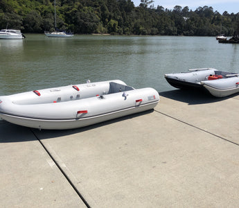 Navigator 300 and Discovery 280 by the lake