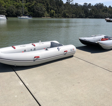 Navigator 300 and Discovery 280 by the lake