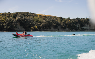 people riding an inflatable boat