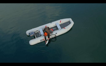 Inflatable Fishing Kayak - releasing a fish from the True Kit Tactician